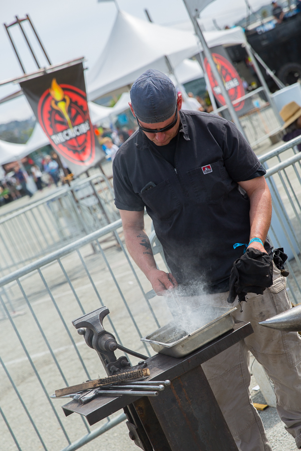 Anvil and Forge Heat treatment and metal quenching techniques are demonstrated at The Crucible's exhibit in the South Lot.